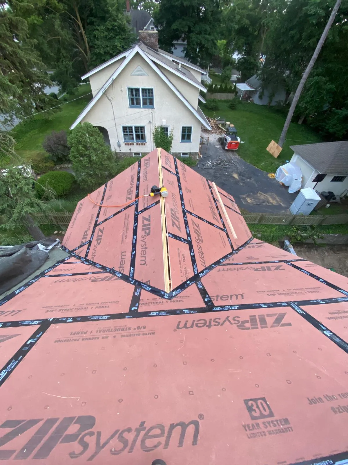 Roofing contractor installing asphalt shingles in Connecticut